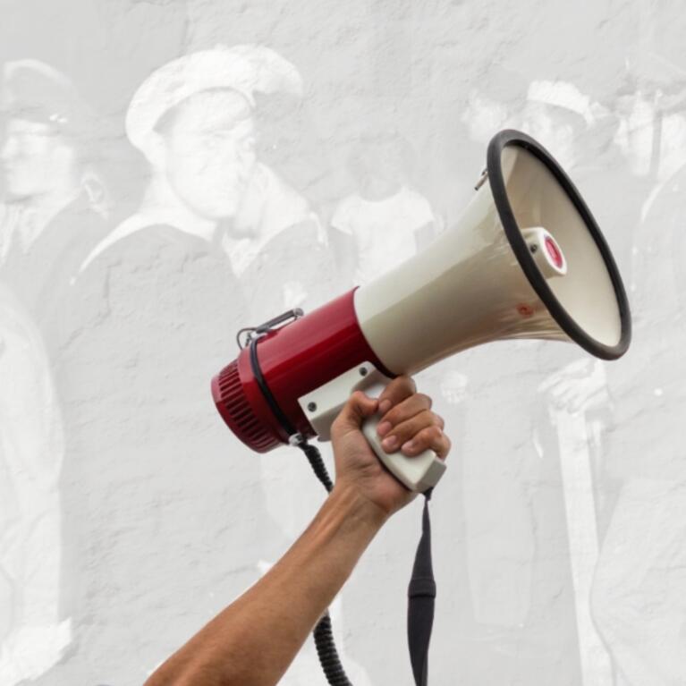 HIST 197 Image of protest in background and bullhorn
