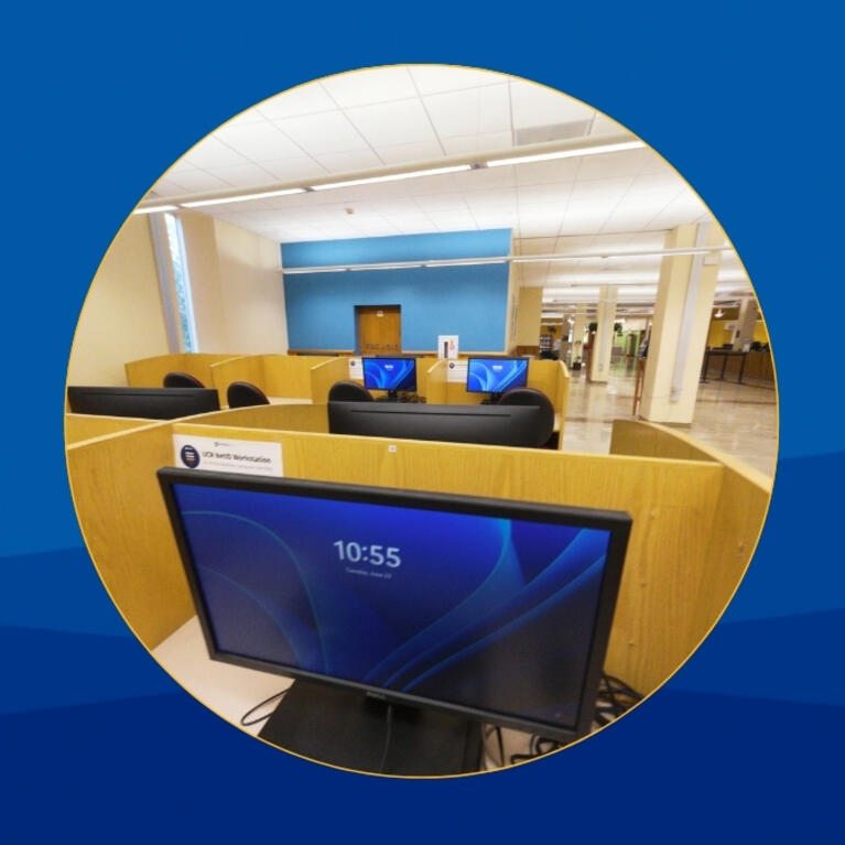 blue backgroung with a circular photo in the middle that features a desktop computer on the first floor of Rivera Library. 