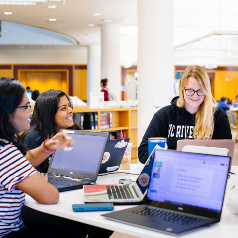 Students in Orbach Library studying and talking