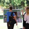 Person viewing poster exhibit