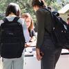 Students viewing a table at the fair