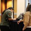 Image of UCR Library staff members singing Steve's well wishes book. 