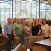 Members of UCR Library's leadership team post with Steve against a photo backdrop.