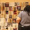 A UCR Library staff members checks out the photo back drop. 