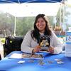 UCR librarian Sandy Enriquez poses with the Scotty sticker zine. 