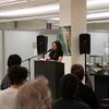 Laila Lalami reads at a podium to a seated audience in the Special Collections Reading Room