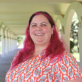 Image of Mary-Michelle Moore outside of the Rivera Library.